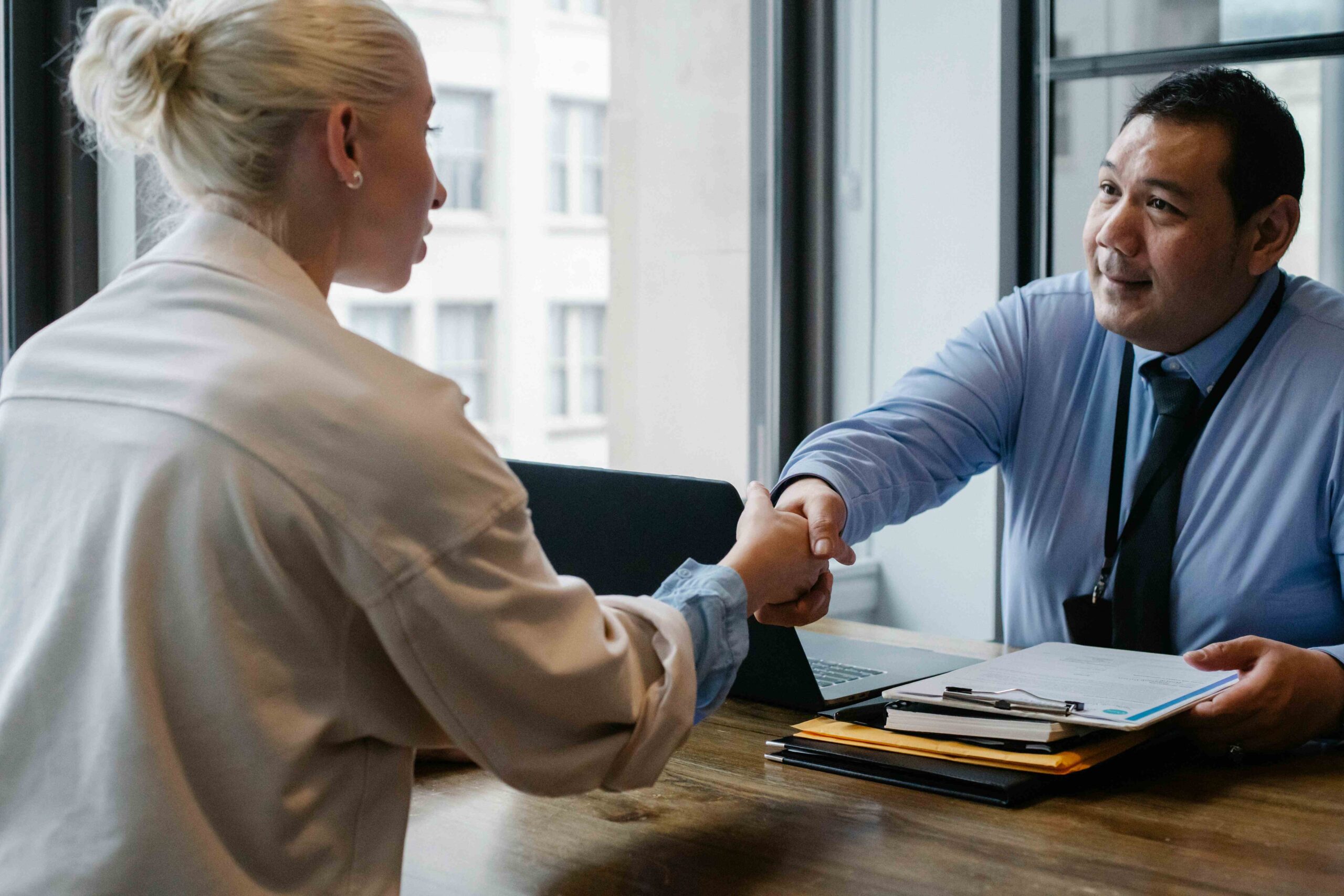 Clearance Experts consultant helping a client with their application documents